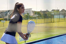 Jasmine Dedakia playin padel with a white raquex racket