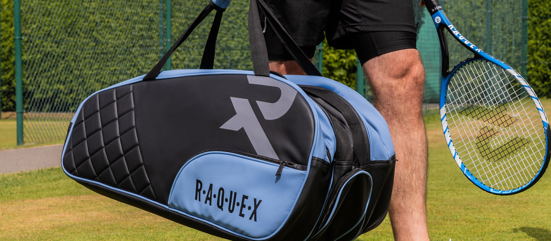 Man holding a blue and black Raquex padel bag on a court