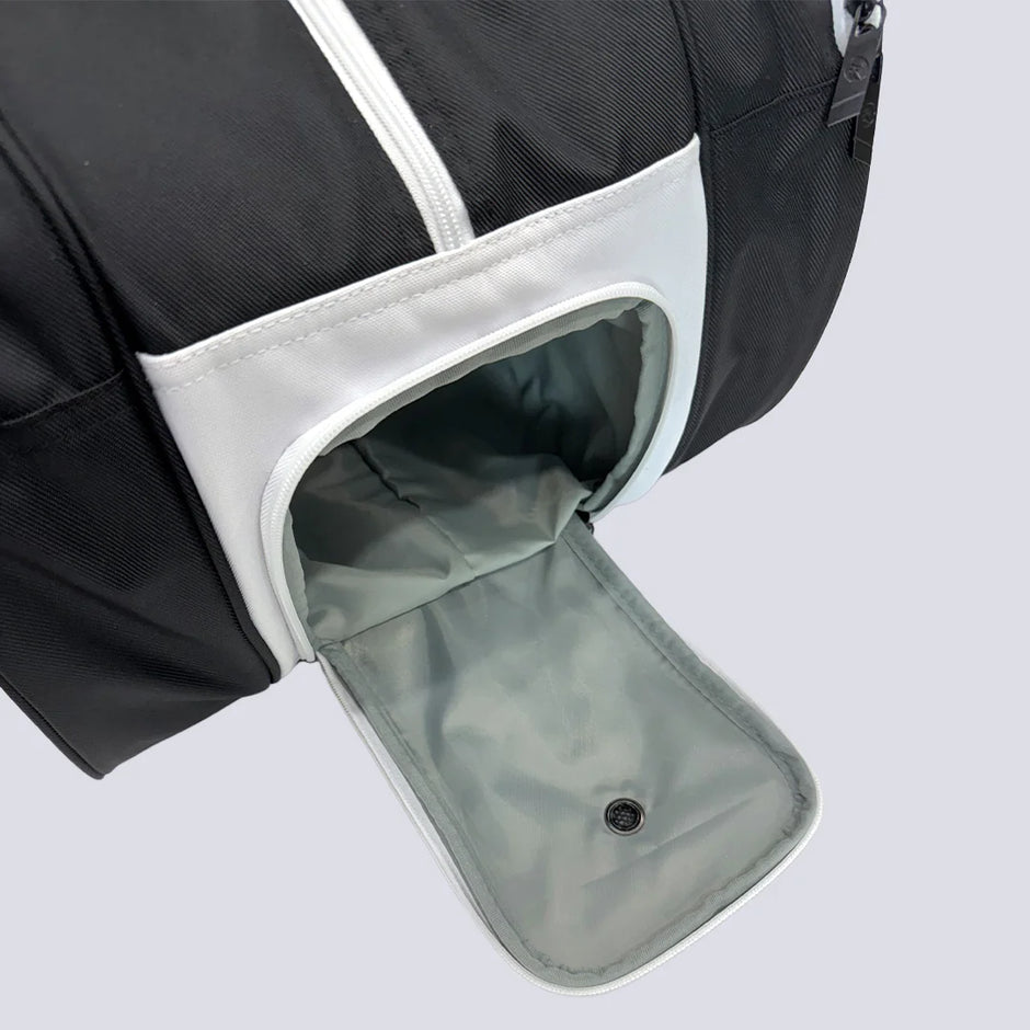 Separate end compartment on the Raquex Elevate Tour bag opened to show the lined trainer pocket