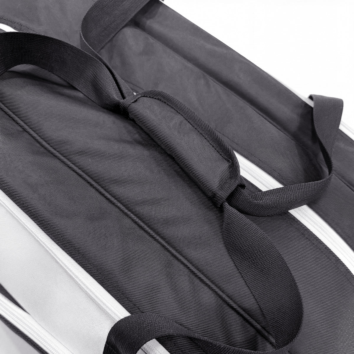 Twin padded carry handles with wrap grip on the Raquex Elevate Tour bag