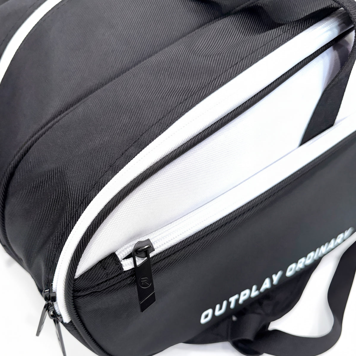 Branded Raquex zip pull and white lined interior on the Elevate Tour bag