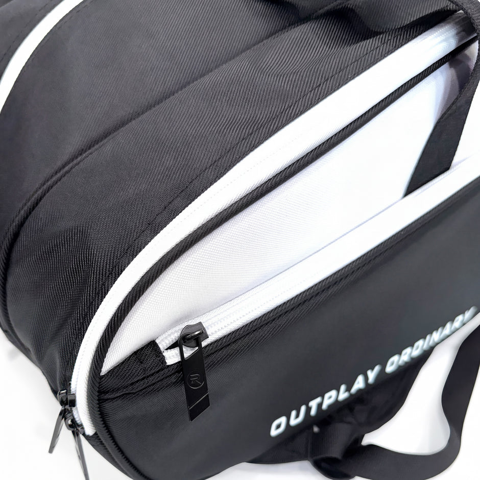 Branded Raquex zip pull and white lined interior on the Elevate Tour bag