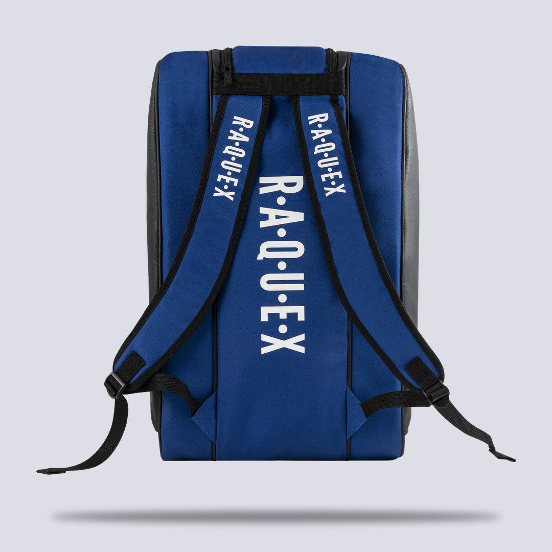 Rear of the blue Raquex Execute Tour padel bag showing the twin underside shoulder straps for backpack carry