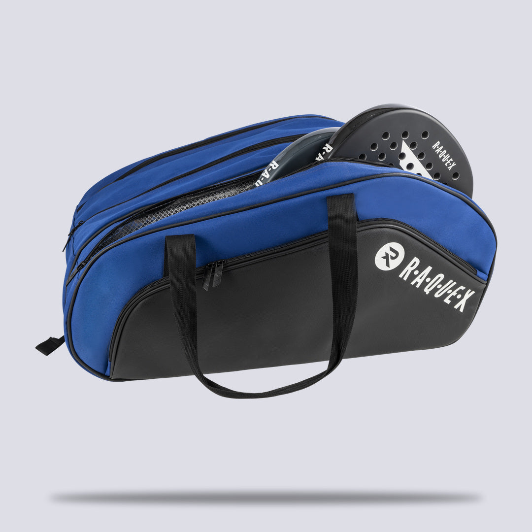 Thermal-lined racquet compartment open on the blue Raquex Execute Tour padel bag with a padel racquet inside