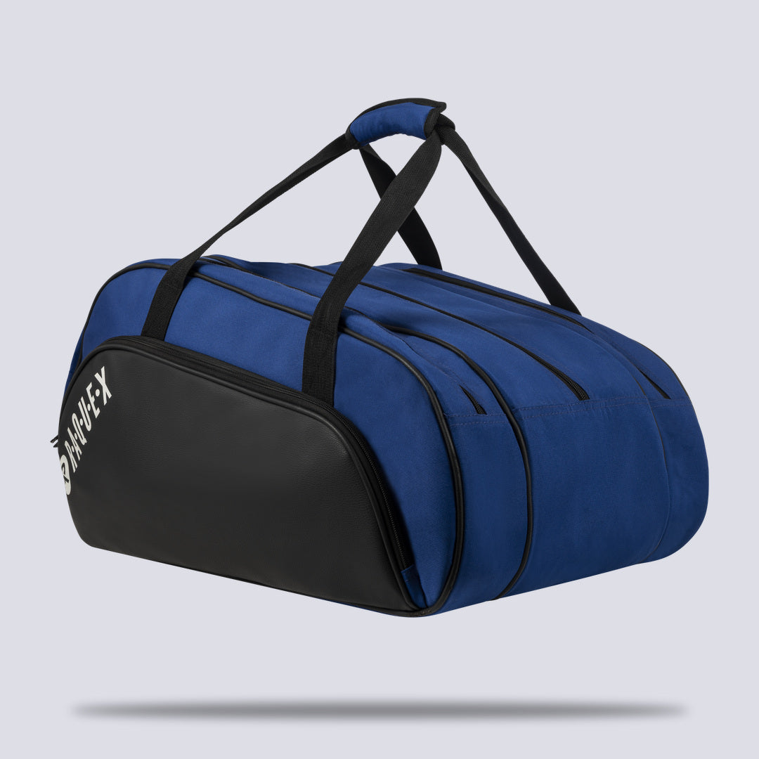 Rear three-quarter view of the blue Raquex Execute Tour padel bag showing the full zip layout