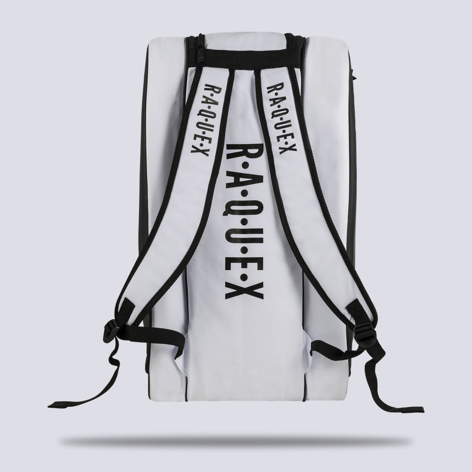 Rear of the white Raquex Execute Tour padel bag showing the twin underside shoulder straps for backpack carry