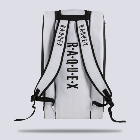 Rear of the white Raquex Execute Tour padel bag showing the twin underside shoulder straps for backpack carry