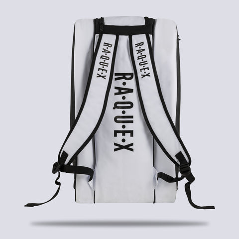 Rear of the white Raquex Execute Tour padel bag showing the twin underside shoulder straps for backpack carry