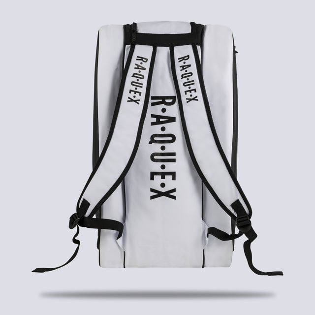 Rear of the white Raquex Execute Tour padel bag showing the twin underside shoulder straps for backpack carry