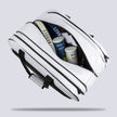 Central compartment of the white Raquex Execute Tour padel bag loaded with racquets, ball tubes and kit