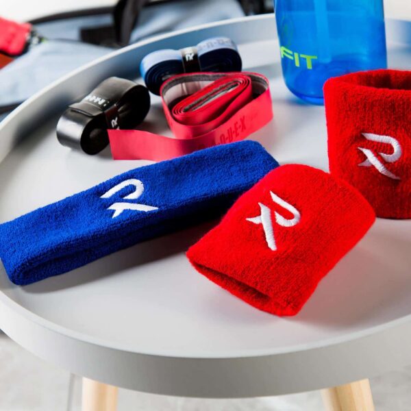A selection of racquet grips, a headband, water bottle and wristbands, ideal for any sport